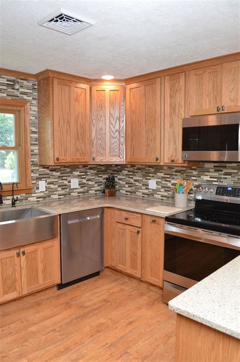 golden oak honey oak cabinets with stainless steel appliances|honey oak cabinets blue.